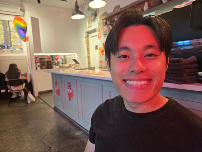 Toan smiling in front of roti made by the chef