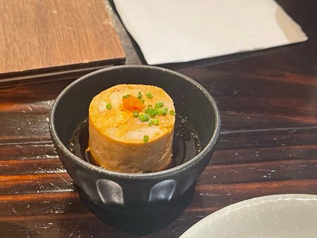 Photo of a small bowl of Japanese steamed monkfish liver.