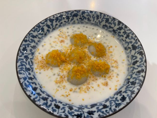 Photo of Hong Kong styled sweet sticky rice dumpling with salted egg yolk crumble in coconut milk with sago.